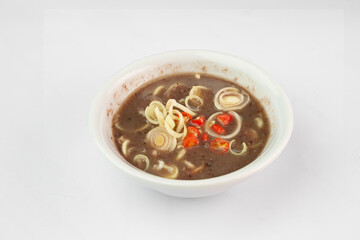 Shrimp paste with sliced lemongrass  and chilli Sauce. Shrimp paste chili paste in white bowl. Mam tom 