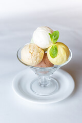 coloured ice cream in a glass bowl on a white background isolated
