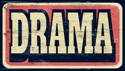 Aged and worn drama sign on wood