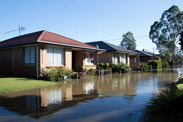 Fototapeta premium Suburban houses with water up to their windows after a flood