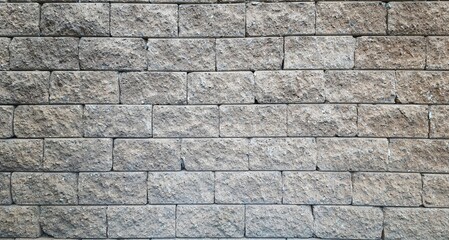 Old brown brick wall background, light brown rough brick wall background. Wall stone brick grey texture.