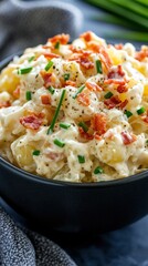 Delicious german potato salad with crispy bacon and fresh chives for culinary inspiration