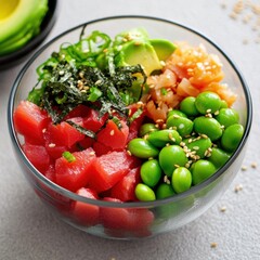 A fresh and colorful poke bowl with tuna, avocado, edamame