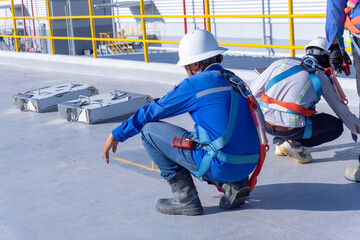 Engineer is working inspection damaged of roof slab of watertank finding concrete crack and damaged...