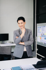 Young attractive businessman office worker business suits smiling at camera in office