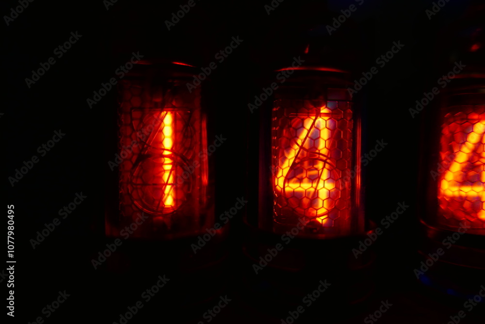Poster retro nixie lamp indicator clock on dark background. the nixie tube indicator of the numbers of retr