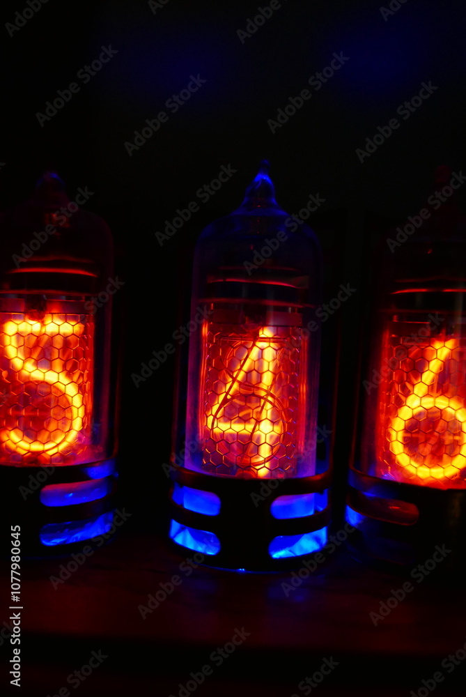 Poster retro nixie lamp indicator clock on dark background. the nixie tube indicator of the numbers of retr