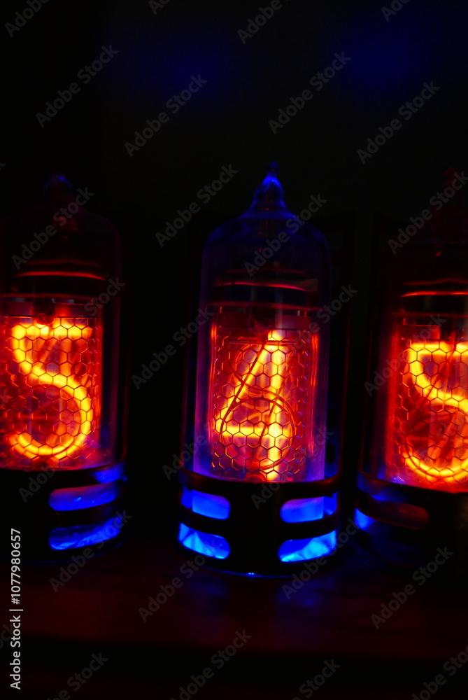 Poster retro nixie lamp indicator clock on dark background. the nixie tube indicator of the numbers of retr