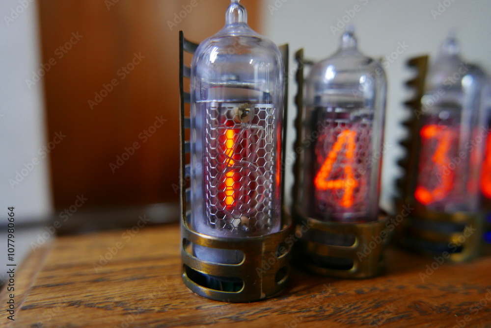 Poster retro nixie lamp indicator clock on dark background. the nixie tube indicator of the numbers of retr