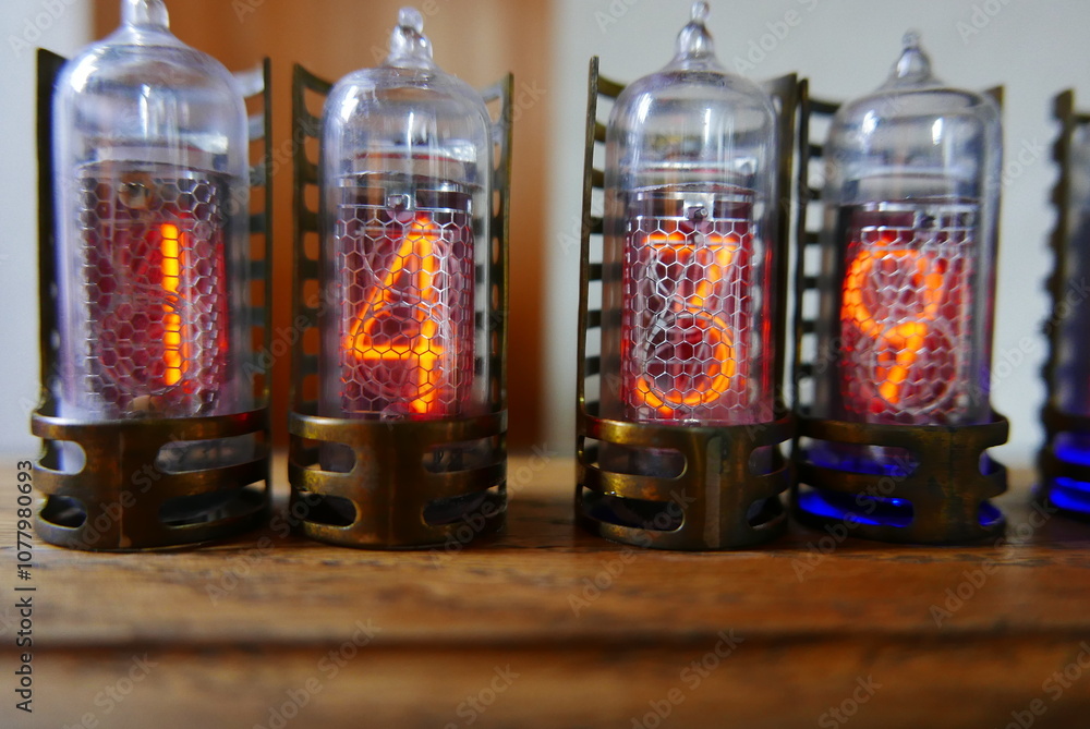 Poster retro nixie lamp indicator clock on dark background. the nixie tube indicator of the numbers of retr