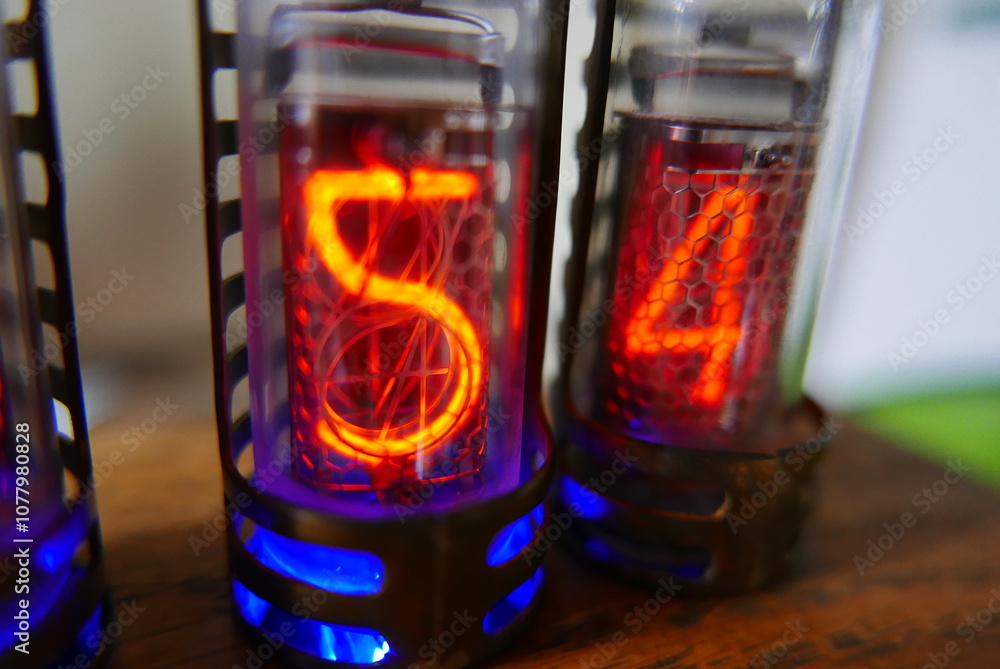 Poster retro nixie lamp indicator clock on dark background. the nixie tube indicator of the numbers of retr