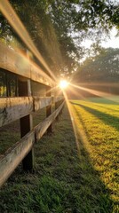Serene sunrise over green pastures and endless wooden fences