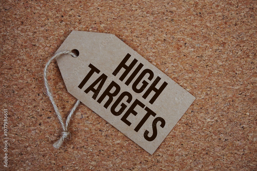 Poster high targets text on price tag with alarm clock on cork board background