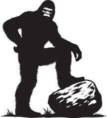 Bigfoot silhouette posing with a large boulder