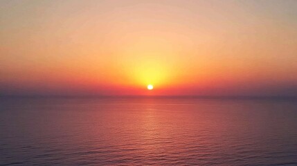 A serene sunset over calm ocean waters, creating a tranquil and picturesque scene.