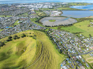 Aerial view of Mangere Mountain in the suburb of Mangere Bridge, Auckland, New Zealand