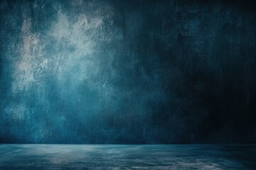 Dark blue grunge background with spotlight and floor.
