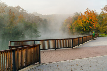 Csónakázó Lake in Miskolc, displaying autumn colors. Amazing morning light and mist