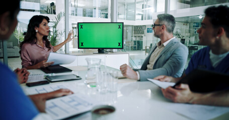 Business people, medical team or meeting with monitor or green screen for presentation or discussion at conference. Group, health employees and speaker with documents or mockup for online webinar