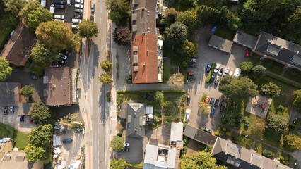 Fototapeta premium Aerial View of Residential Neighborhood with Greenery and Parking