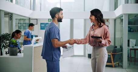 Doctor, meeting and tablet with handshake for contract, agreement or hiring nurse at hospital. Man,...