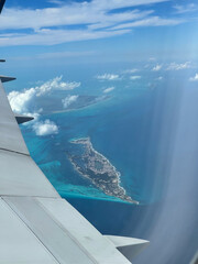 Aerial View of Tropical Island from Airplane Window