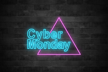 Obraz premium Neon light text of Cyber Monday on black brick wall background