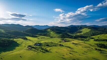Fototapeta premium Aerial view of lush green hills and valleys under a bright blue sky with scattered clouds.