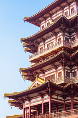ancient pagoda Chinese buddhist temple on the blue sky