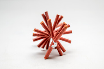 Red fire crackers string isolated over white background