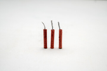 Red fire crackers isolated over white background