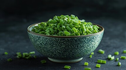 A bowl of freshly chopped green onions on a textured surface.