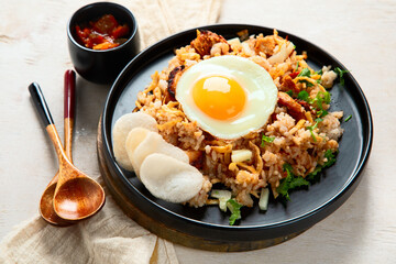 Nasi goreng- Indonesian fried rice with fried egg.