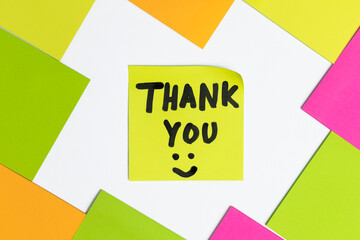 Handwritten of thank you text on colorful sticky notes isolated on white background