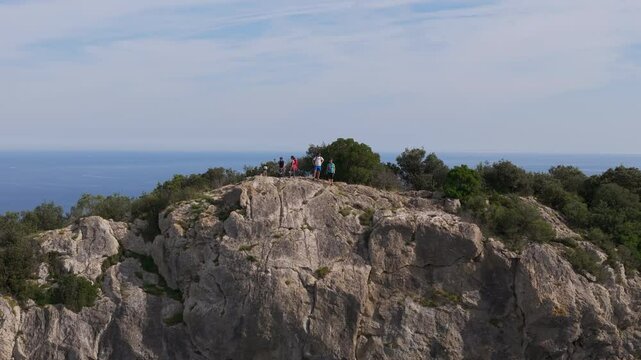 Aerial footage of tourists standing at "Ogono.Talaia gailurra" observation deck in Biscay, Spain