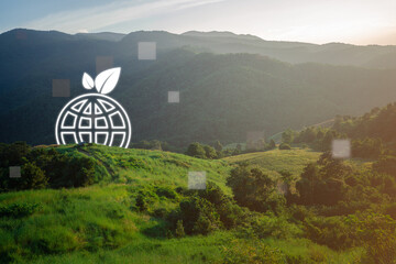 A breathtaking landscape inspires a vision for a sustainable future as a digital globe showcases...