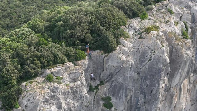 Aerial footage of tourists climbing the Ogono.Talaia gailurra observation deck in Biscay, Spain