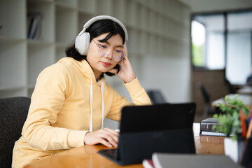 education, online, studying, E learning, young Asian woman having video call on her computer at...