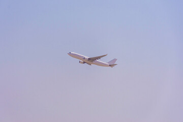 An airplane takes off from the Dubai International Airport, United Arab Emirates.