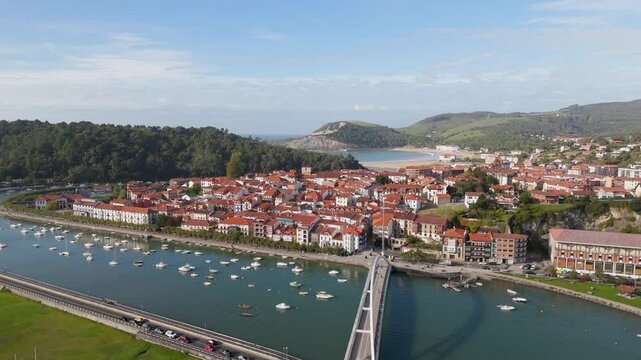 Aerial footage of Geltokiko Zubia bridge crossing Plentziako Itsasadarra river in Plentzia, Spain