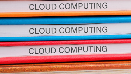 The concept of technology and development. Phrase, words, text CLOUD COMPUTING close-up on the ends...