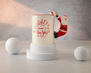 Merry Christmas and Happy New Year. White ceramic cup with Santa Claus and white props on a gray background.