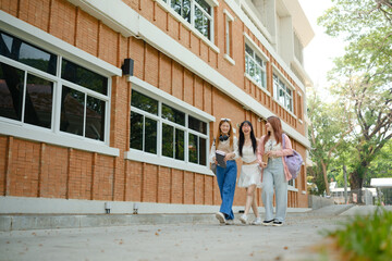 Obraz premium Three young women walking down a brick sidewalk