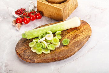 Ripe sliced leek over board