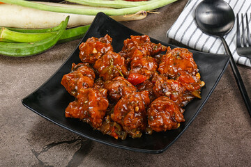 Manchurian chicken with sauce and spices