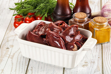 Raw chicken liver uncooked in the bowl