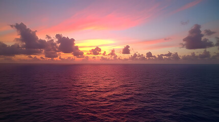vibrant sunset sky over ocean, filled with colorful clouds reflecting on water surface, creates serene and peaceful atmosphere