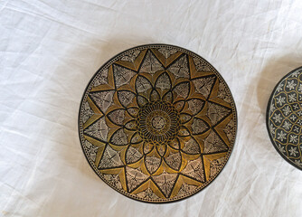 A Fruit Plate made up of Copper-Zinc metal and inlaid with Silver and Gold known as 'Bidriware' art by the artisans in Bidar town in Karnataka, India.