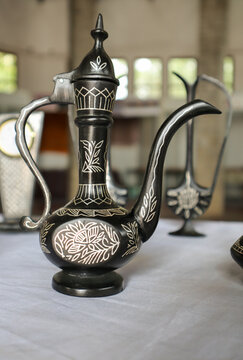 A 'Wine Jug' made up of Copper-Zinc metal and inlaid with Silver known as 'Bidriware' art by the traditional artisans in Bidar town in Karnataka, India.