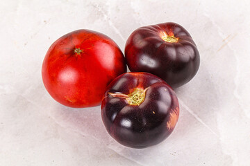 Black ripe juicy organic tomato